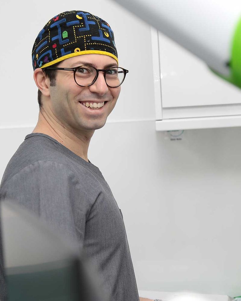 Dr Eric Battista with the X-Guide navigation system during implant surgery