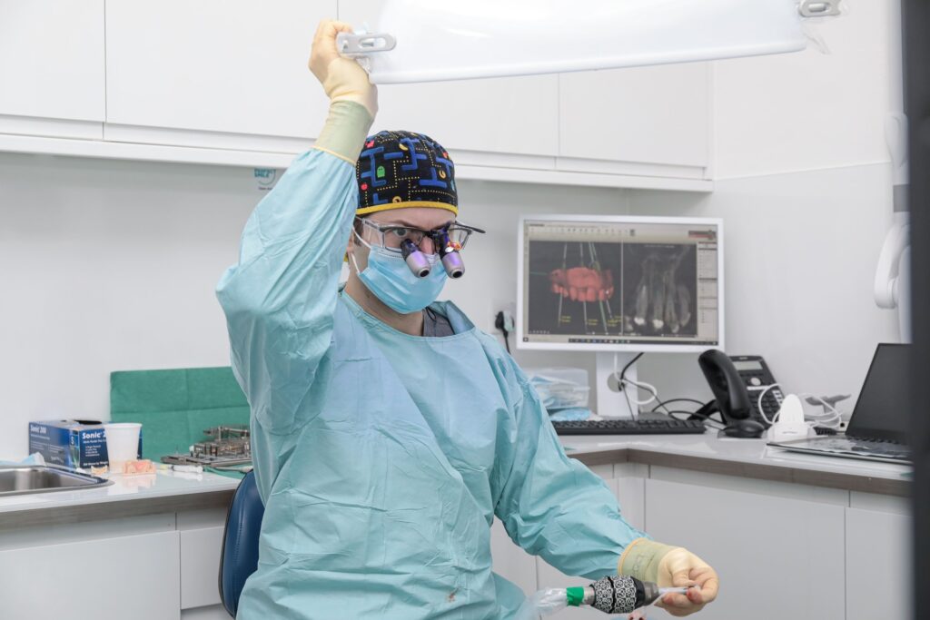 Dr Eric Battista, oral surgeon in London, in theatre at EB Dental